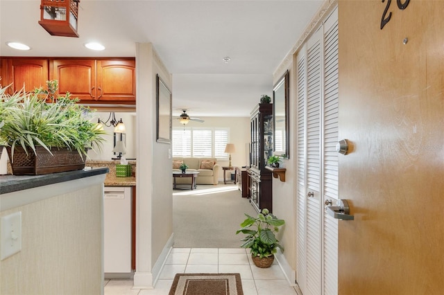2595 Countryside Blvd Unit 8205, Clearwater, FL 33761 - corridor with light tile patterned flooring, baseboards, recessed lighting, and light carpet