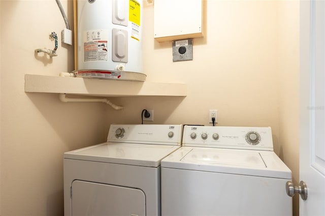 2595 Countryside Blvd Unit 8205, Clearwater, FL 33761 - washroom featuring laundry area, washer and clothes dryer, and water heater
