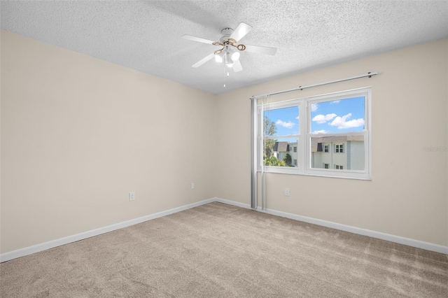 381 S Mcmullen Booth Rd Unit 72, Clearwater, FL 33759 - unfurnished room with carpet flooring, a textured ceiling, ceiling fan, and baseboards