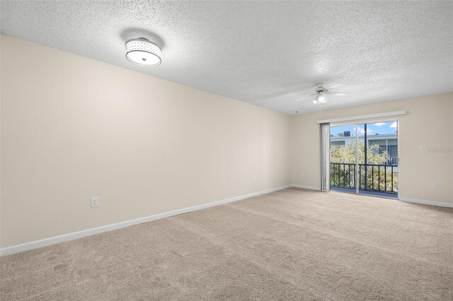 381 S Mcmullen Booth Rd Unit 72, Clearwater, FL 33759 - unfurnished room featuring baseboards, ceiling fan, light carpet, and a textured ceiling
