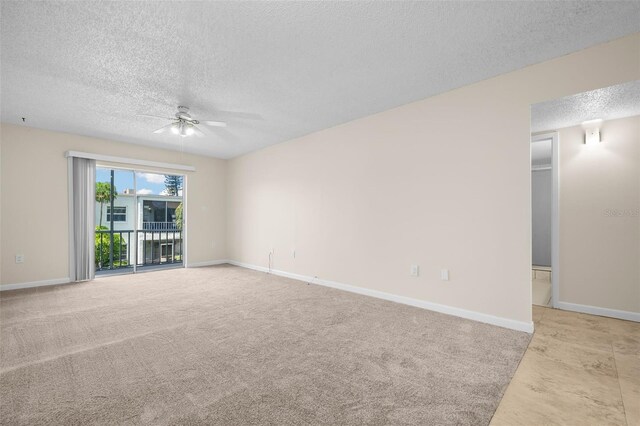 381 S Mcmullen Booth Rd Unit 72, Clearwater, FL 33759 - carpeted empty room with baseboards, a ceiling fan, and a textured ceiling