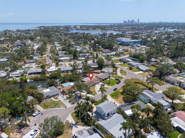 bird's eye view with a water view, a residential view, and a city view