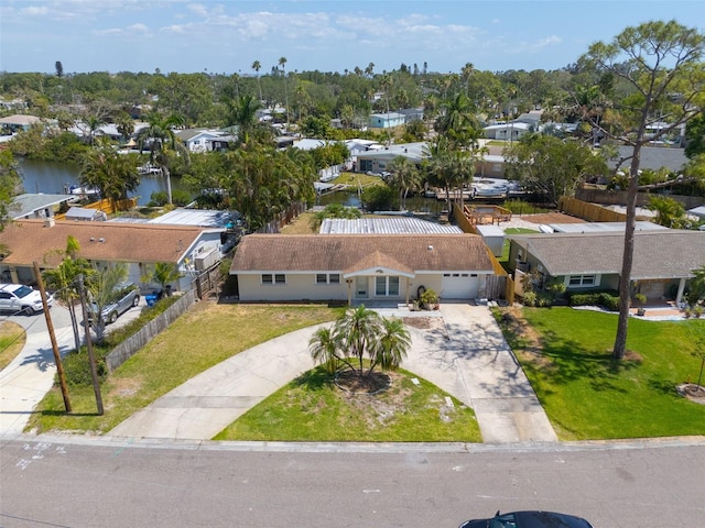 drone / aerial view with a residential view and a water view