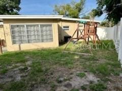 5443 Tangerine Dr, New Port Richey, FL 34652 - rear view of house featuring fence