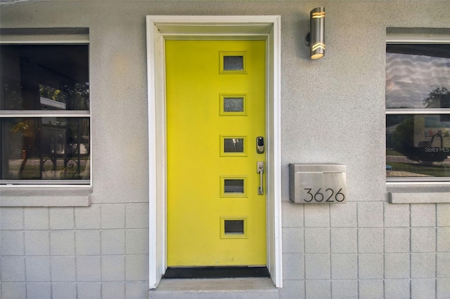 3626 17th St N, Saint Petersburg, FL 33713 - doorway to property featuring stucco siding