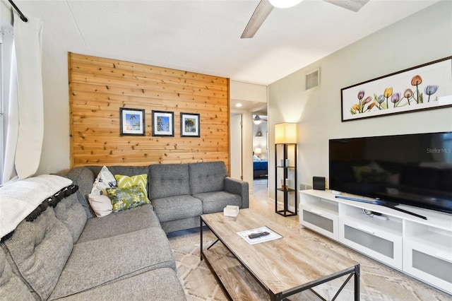 3626 17th St N, Saint Petersburg, FL 33713 - living room featuring wooden walls, a ceiling fan, and visible vents