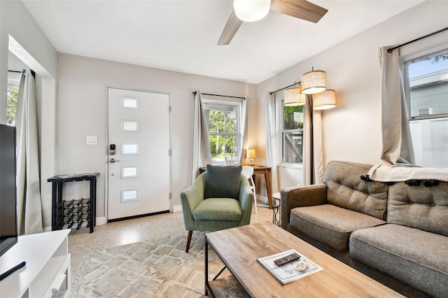 3626 17th St N, Saint Petersburg, FL 33713 - living area featuring ceiling fan, a wealth of natural light, baseboards, and light speckled floor