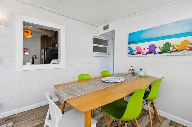 3626 17th St N, Saint Petersburg, FL 33713 - dining room featuring baseboards, visible vents, and wood finished floors