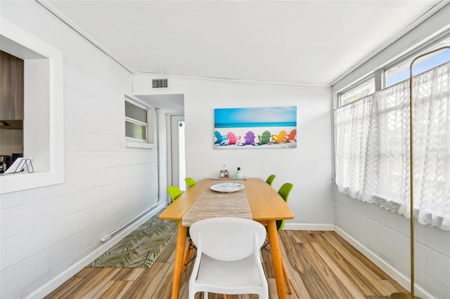 3626 17th St N, Saint Petersburg, FL 33713 - dining room featuring baseboards, visible vents, and wood finished floors