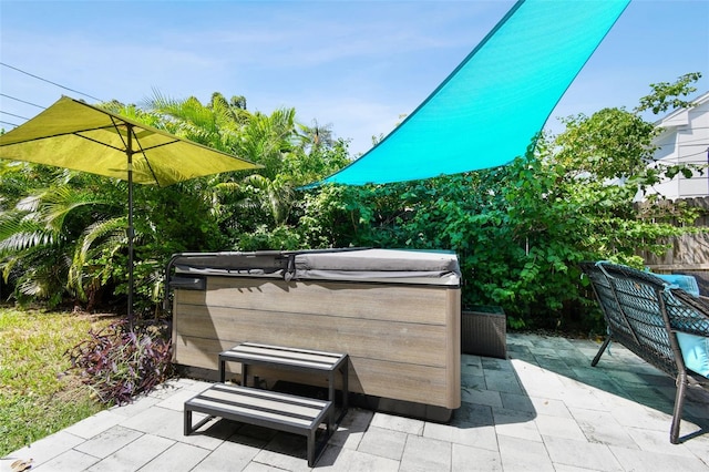 3626 17th St N, Saint Petersburg, FL 33713 - view of patio with a hot tub and fence