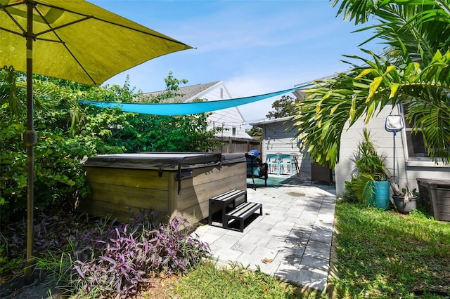 3626 17th St N, Saint Petersburg, FL 33713 - view of patio with a hot tub and fence