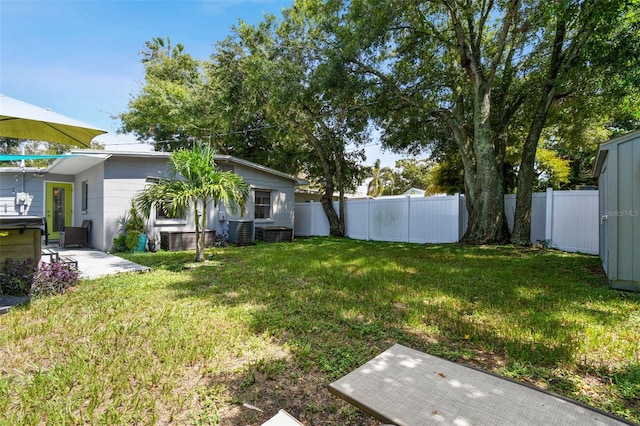 3626 17th St N, Saint Petersburg, FL 33713 - view of yard featuring central air condition unit, a patio area, and a fenced backyard