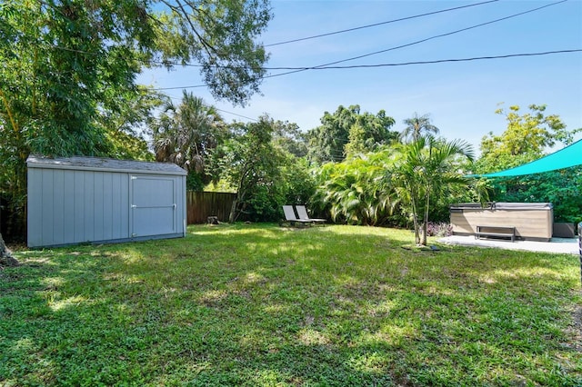 3626 17th St N, Saint Petersburg, FL 33713 - view of yard featuring a storage unit, fence, and an outbuilding