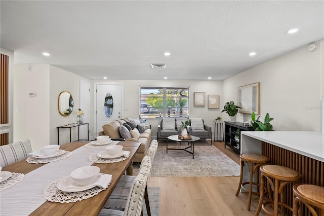 dining room with recessed lighting, visible vents, and light wood-style flooring