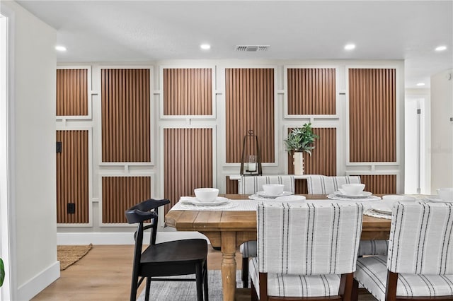 dining room featuring recessed lighting, visible vents, and wood finished floors