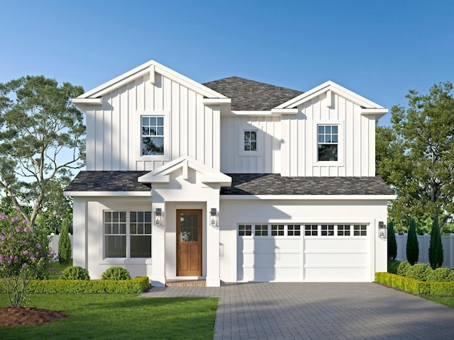 modern farmhouse featuring a garage, board and batten siding, and decorative driveway