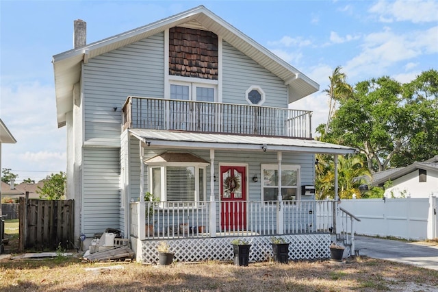 757 32nd Ave N, Saint Petersburg, FL 33704 - view of front of property featuring a balcony, fence, and covered porch