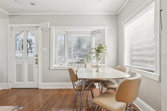 757 32nd Ave N, Saint Petersburg, FL 33704 - dining area featuring crown molding, baseboards, a healthy amount of sunlight, and wood finished floors