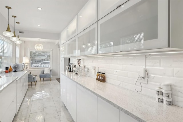 757 32nd Ave N, Saint Petersburg, FL 33704 - bar with pendant lighting, tasteful backsplash, marble finish floor, a chandelier, and recessed lighting