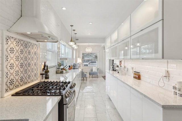 757 32nd Ave N, Saint Petersburg, FL 33704 - kitchen featuring decorative backsplash, modern cabinets, stainless steel gas stove, white cabinets, and custom exhaust hood