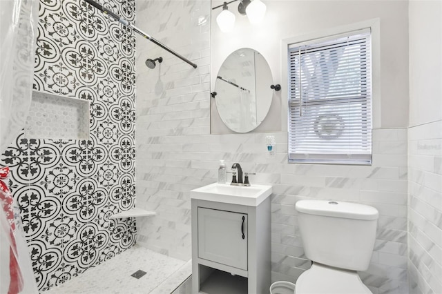 757 32nd Ave N, Saint Petersburg, FL 33704 - bathroom featuring toilet, tile walls, tiled shower, and vanity