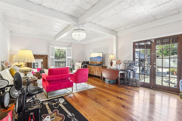 757 32nd Ave N, Saint Petersburg, FL 33704 - living room featuring french doors, hardwood / wood-style flooring, beam ceiling, a chandelier, and coffered ceiling