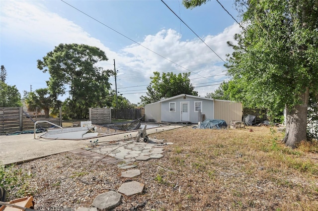 757 32nd Ave N, Saint Petersburg, FL 33704 - view of yard with a patio, an outdoor structure, and fence