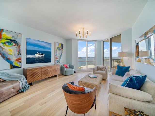 331 Cleveland St # 1806, Clearwater, FL 33755 - living area featuring floor to ceiling windows, wood finished floors, a notable chandelier, and a wealth of natural light