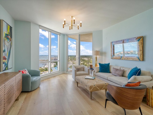 331 Cleveland St # 1806, Clearwater, FL 33755 - living room with a water view, a notable chandelier, and light wood-style floors