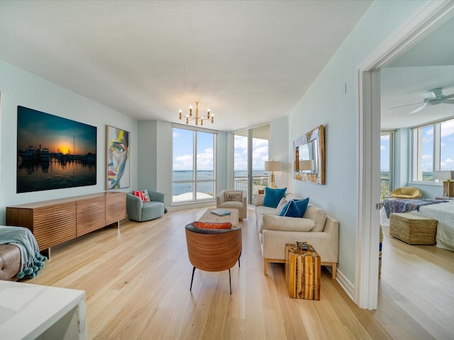 331 Cleveland St # 1806, Clearwater, FL 33755 - living room with an inviting chandelier, a healthy amount of sunlight, and light wood-type flooring