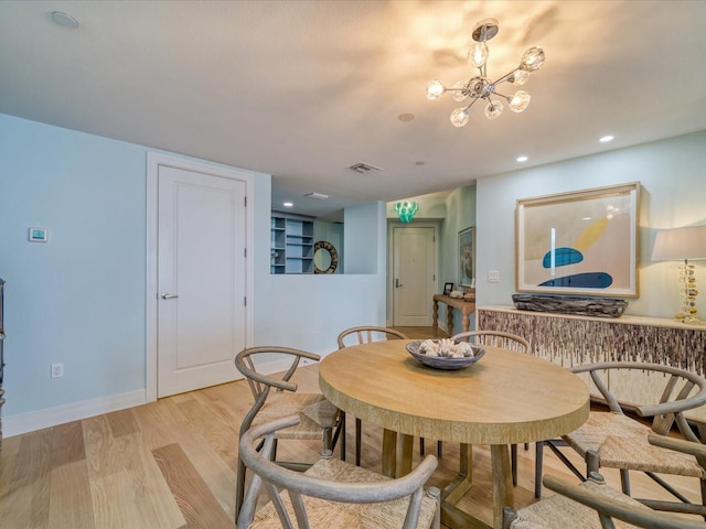 331 Cleveland St # 1806, Clearwater, FL 33755 - dining room with visible vents, light wood-style floors, baseboards, recessed lighting, and a notable chandelier