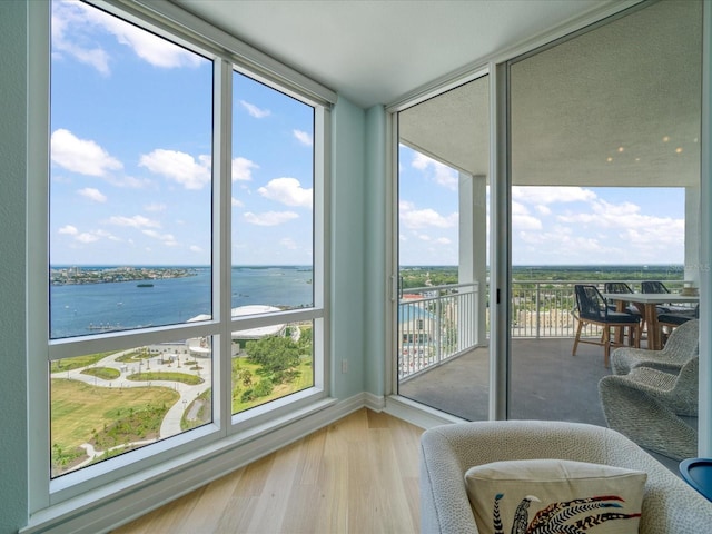 331 Cleveland St # 1806, Clearwater, FL 33755 - interior space with baseboards, a water view, wood finished floors, and a wall of windows