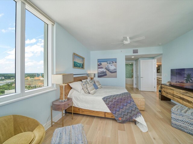 331 Cleveland St # 1806, Clearwater, FL 33755 - bedroom featuring visible vents, baseboards, ceiling fan, and wood finished floors