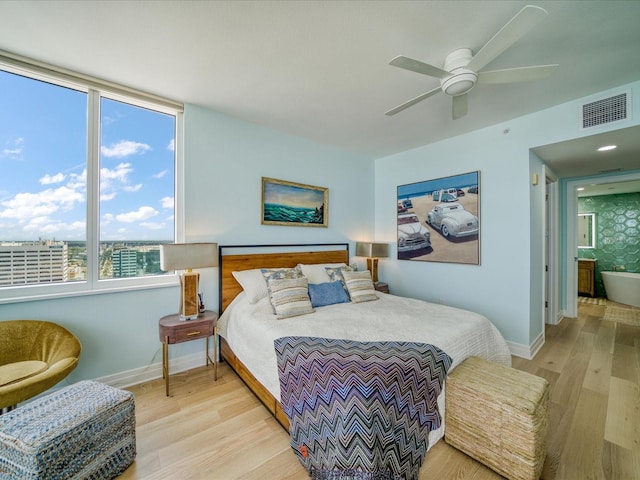 331 Cleveland St # 1806, Clearwater, FL 33755 - bedroom with baseboards, ceiling fan, light wood finished floors, and visible vents