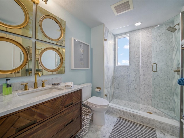 331 Cleveland St # 1806, Clearwater, FL 33755 - bathroom featuring vanity, toilet, visible vents, and a stall shower