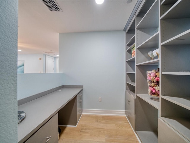 331 Cleveland St # 1806, Clearwater, FL 33755 - unfurnished office featuring baseboards, built in desk, light wood-style flooring, and visible vents