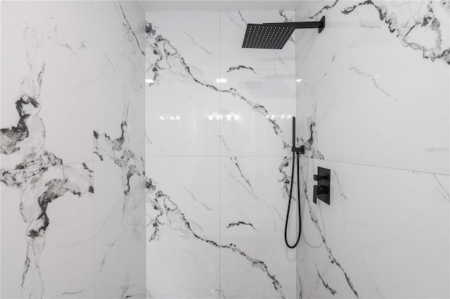 interior space featuring a marble finish shower