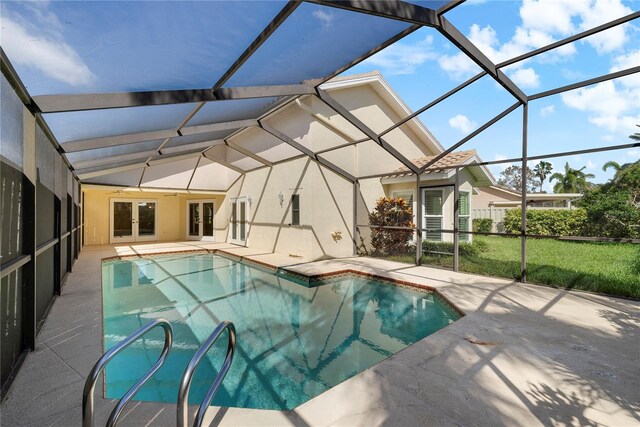 5290 White Sand Cir NE, Saint Petersburg, FL 33703 - swimming pool featuring french doors, a patio, and glass enclosure