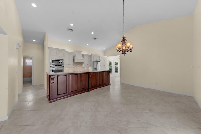 5290 White Sand Cir NE, Saint Petersburg, FL 33703 - kitchen featuring stainless steel appliances, a chandelier, custom exhaust hood, open floor plan, and decorative backsplash