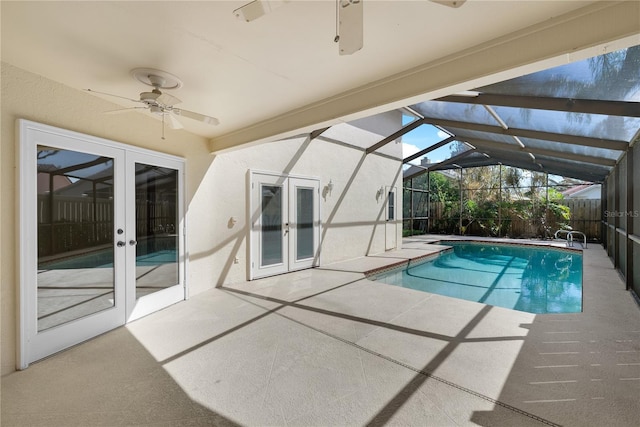 5290 White Sand Cir NE, Saint Petersburg, FL 33703 - view of swimming pool with french doors, a ceiling fan, a patio, and a lanai