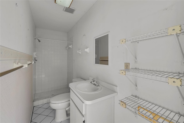5290 White Sand Cir NE, Saint Petersburg, FL 33703 - bathroom with toilet, a stall shower, vanity, and tile patterned floors