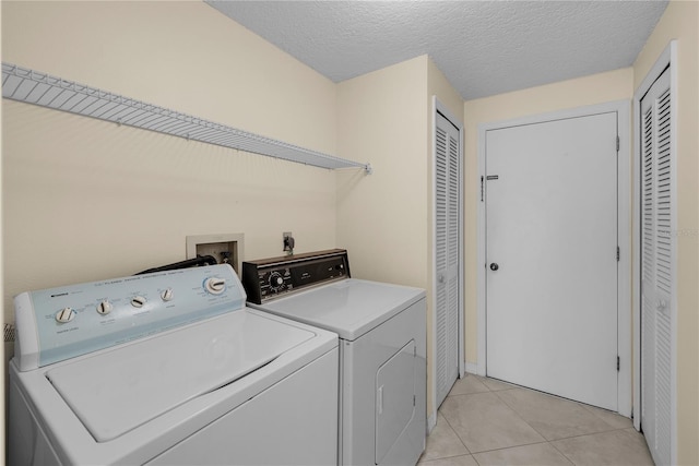 5290 White Sand Cir NE, Saint Petersburg, FL 33703 - washroom featuring washer and clothes dryer and light tile patterned floors