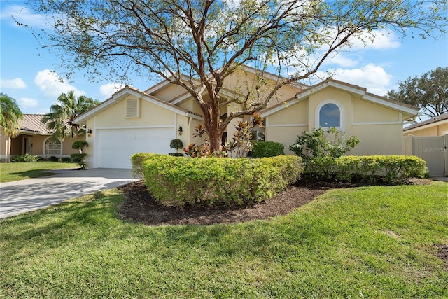 5290 White Sand Cir NE, Saint Petersburg, FL 33703 - ranch-style house featuring stucco siding, concrete driveway, and an attached garage