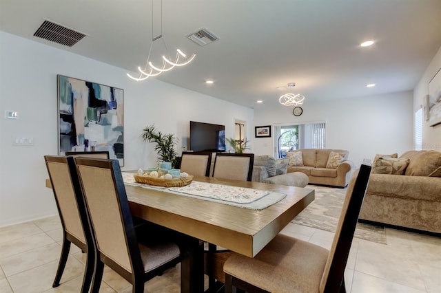 dining space with light tile patterned flooring, a chandelier, recessed lighting, and visible vents