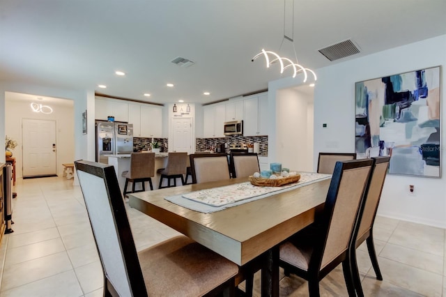 dining space featuring light tile patterned floors, recessed lighting, and visible vents