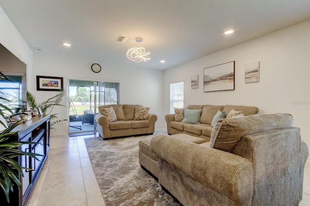 living room featuring visible vents, recessed lighting, light tile patterned floors, and an inviting chandelier