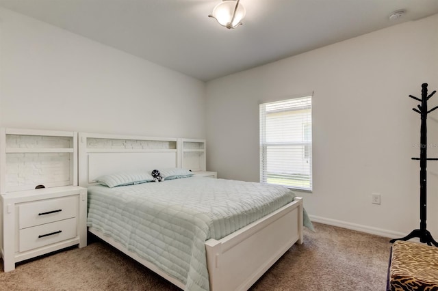 bedroom featuring carpet floors and baseboards