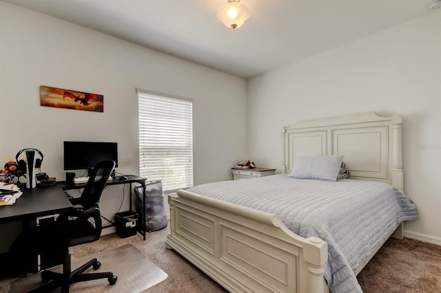 carpeted bedroom featuring baseboards