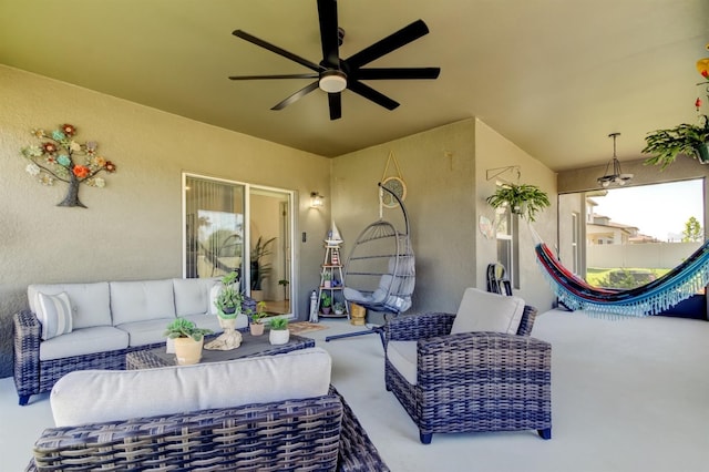 view of patio featuring ceiling fan and an outdoor living space