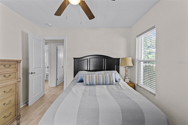 bedroom featuring light wood-style floors and ceiling fan